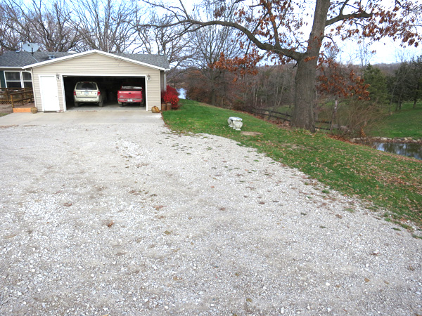 view of driveway leading to garage
