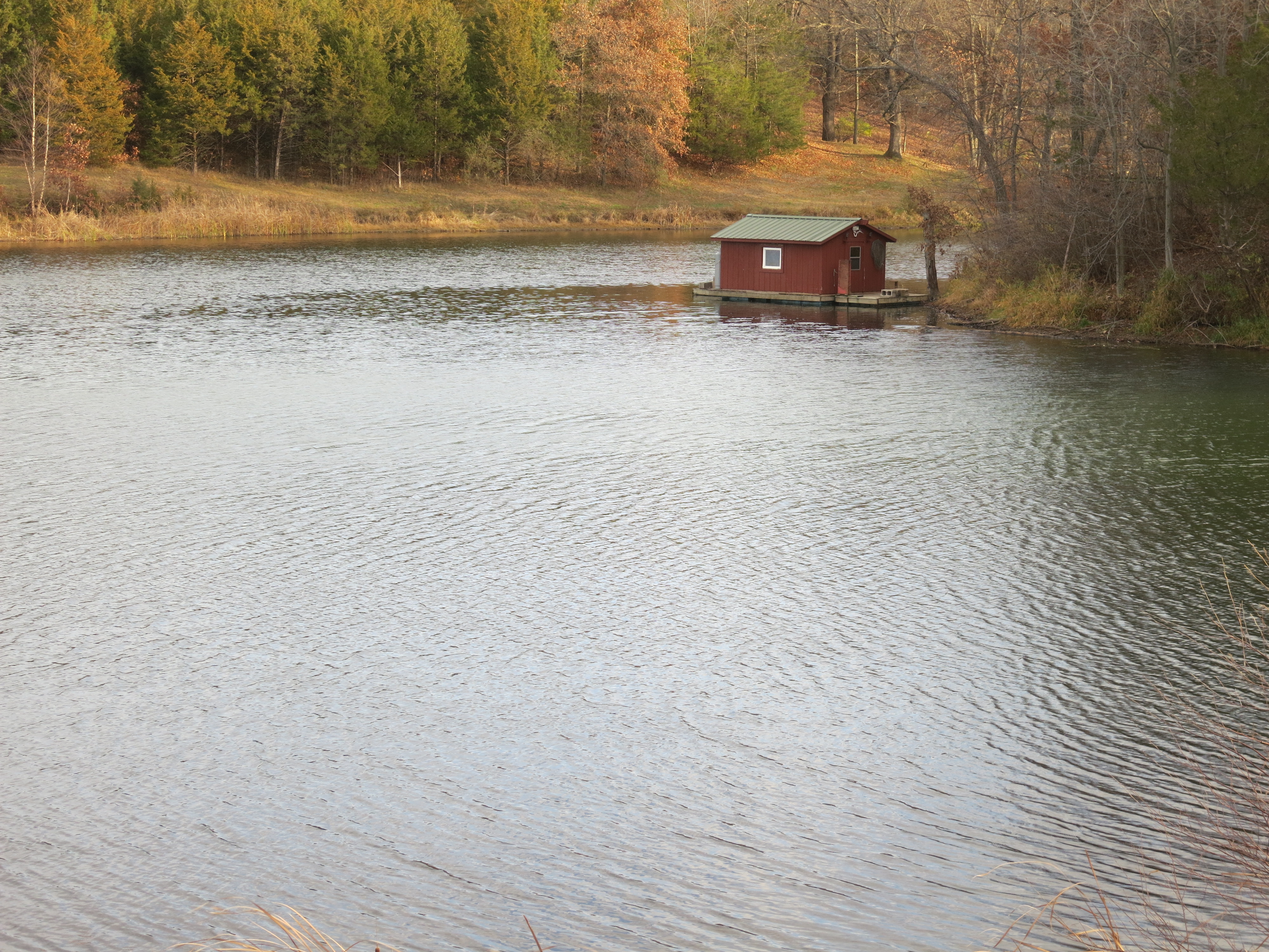 view of lake and dock on wapello county iowa farm for sale