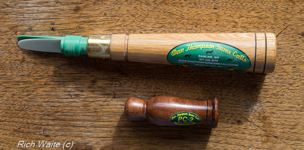 A picture showing two coyote mouth blown calls -- either of which is a good tool for calling in an Iowa coyote.