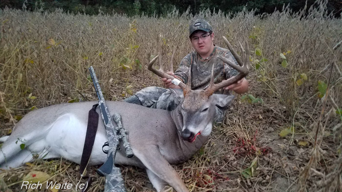 Picture of Tyler and his Iowa youth-season 165-inch buck.